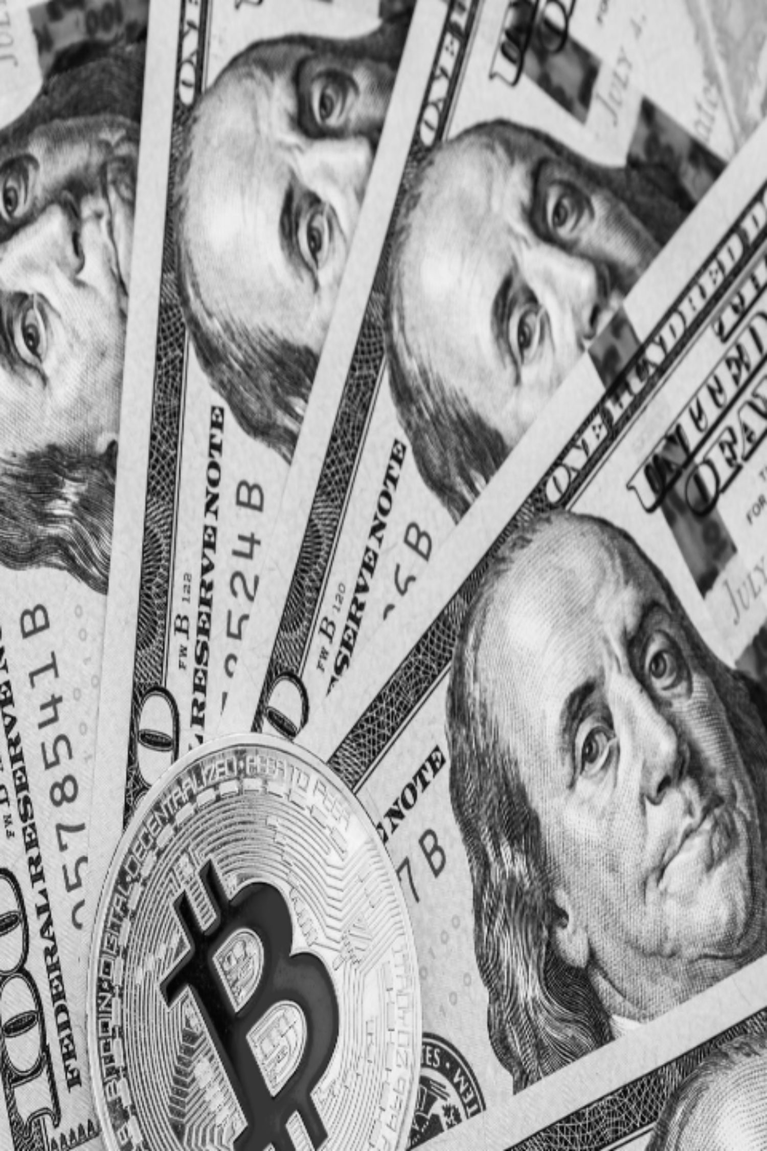 Bitcoin and cryptocurrency on banknotes of one hundred dollars